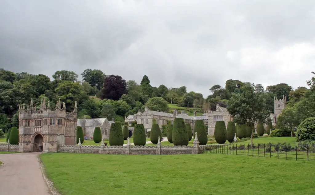 Lanhydrock house and gardens, Cornwall. Grass backed with a large manor house.